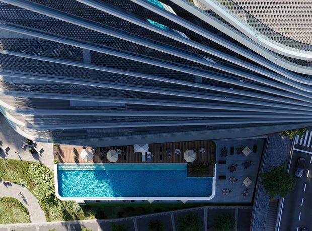 A pool deck and garden on the podium